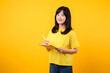 © Jirawatfoto - Experience the joy of education technology with portrait. A young Asian woman wearing a yellow t-shirt and denim jeans showcases a happy smile while using digital tablet. education technology concept.
