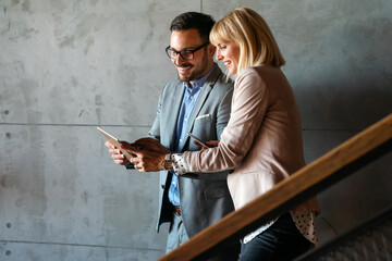 Business people having fun and chatting at workplace office