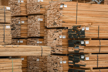 Close up of stacks of lumber being stored in a warehouse