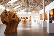 Modern Art Gallery Interior With Wooden Sculptures. Spacious Exhibition Room. Generative AI