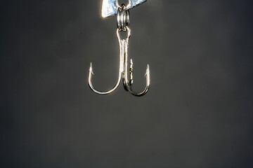 Wall Mural - Fishing hook on a dark background. Close-up.