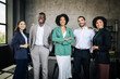 © Prostock-studio - Five Multiethnic Businessmen And Businesswomen Coworkers Posing Standing In Office