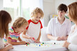 © famveldman - Family playing board game. Kids play.