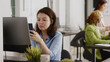 © DC Studio - Successful businesswoman taking social media break at desk, checking online website on smartphone app. Young manager using mobile phone and planning project for investment. Handheld shot.
