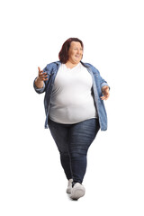 Poster - Happy young overweight woman in casual clothing walking