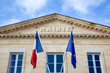 city hall facade of the french town hall with the flags of france and europe