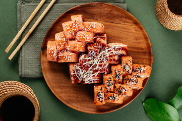 Poster - set of asian sushi rolls on a wooden plate