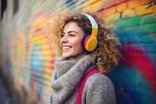 Smiling Emotional Stylish Woman Headphones, Listening To Music On The Graffiti Brick Wall Background. Made With Generative AI
