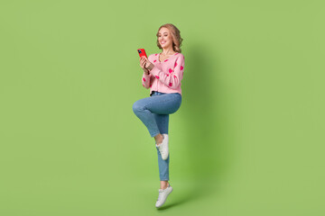 Poster - Full body photo of jump blogger wavy hair lady optimistic browsing gadget fast speed technology shopping isolated on green color background