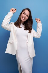 Canvas Print - pleasant european brunette young woman in a white dress with cheerful emotions on her face