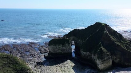 Sticker - Drone landscape footage of The Drinking Dinosaur on Flamborough Head Yorkshire, UK by the sea