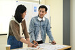 © Prathankarnpap - Creative business colleagues brainstorming, sharing idea for startup project in co working office space