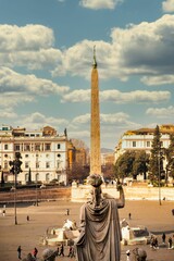 Sticker - Vertical shot of Flaminio Obelisk against old buildings on a cloudy sunny day in Rome, Italy