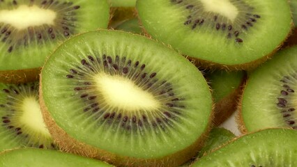 Poster - Closeup of sliced kiwis on a white surface