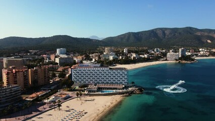 Wall Mural - Aerial footage of boats and buildings in the sea by resort island and shiny sea in Mallorca