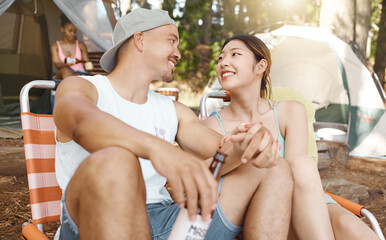 Canvas Print - Camping, love and a young couple in nature while in the forest or woods for travel and adventure. Hiking, relax and a man with his girlfriend drinking beer at their campsite outdoor in the wilderness