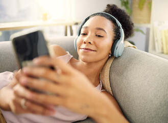 Poster - Headphones, happy and woman with a smartphone, streaming music and listening to audio, podcast and relax. Headset, female person or model on a couch, cellphone and wellness with song, calm and radio