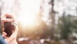 © AlexGo - Man taking photos in beautiful outdoors. Traveling in Alps. Camera mockup