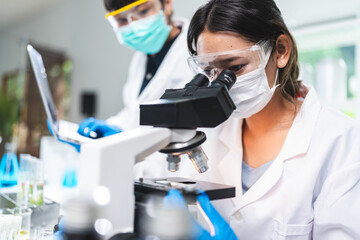 medicine experiment and chemical biology study in science laboratory research, scientist testing part green plant on scientific glasses in chemistry technology, nature leaf in medicals biotechnology