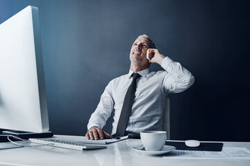 Canvas Print - Phone call, computer and business man at desk online for discussion, talking and contact in office. Thinking, corporate and happy mature male person on smartphone for conversation, chat and planning