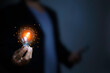 © okawa - Businessman Touching Icon Bulb.Concept of Ideas for success.Concept with innovation inspiration.Success start from new ideas to innovative technology relying on information from the internet big data.