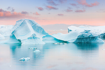 Wall Mural - Icebergs in Atlantic ocean at sunset. Ilulissat icefjord, western Greenland..