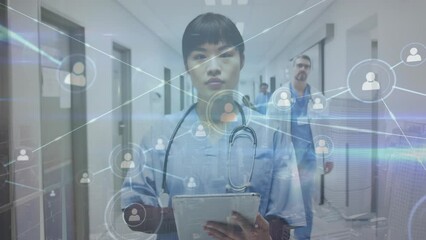 Wall Mural - Animation of network of connections over asian female doctor in hospital