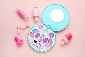 Sticker - Eye shadow palette and other decorative cosmetics for kids on pink background, flat lay