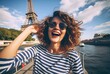 Leinwandbild Motiv a girl taking a selfie in paris with the eiffel tower