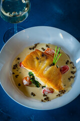 Wall Mural - Chilean Sea Bass with Heirloom Tomatoes and Capers in a White Wine Garlic Sauce