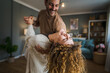 © Miljan Živković - Happy couple adult caucasian man woman husband and wife dance at home