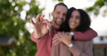 Couple, New Home And Outdoor With Keys In Hand After Buying Or Renting Real Estate Property. Mortgage, Investment And Loan For First House With A Happy Man And Woman Moving In As Excited Homeowners