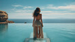 Leinwandbild Motiv a young pretty woman in a bikini standing by a pool and looking at the sea. summer vacation on the beach concept. Generative AI
