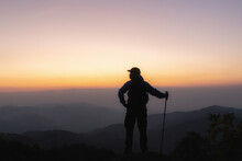 Young Man Standing Alone In Forest Outdoor With Sunset Nature On Background Travel Lifestyle And Survival Concept.