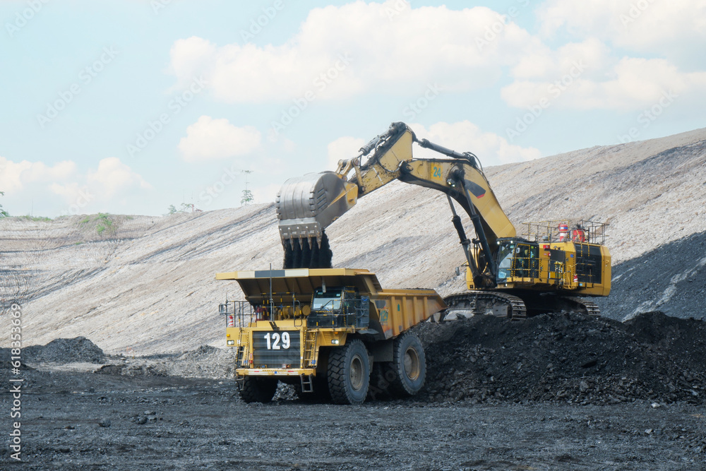 coal loading from excavator into truck, coal mine industry Stock Photo ...
