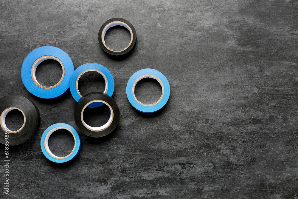 Adhesive tape rolls on black background