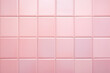 © Firn - Background with pastel pink rectangular tiles.