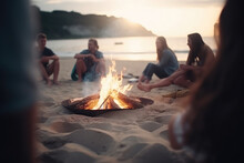 Blurred Group Of Young Friends Sitting By The Fire At Summer Beach, Grilling Sausages And Drinking Tea, Talking. Blurred Friends Have Fun On The Beach. Summer Vacations, Lifestyle Concept