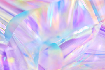 Poster - Close-up of ethereal pastel neon blue, purple, lavender, yellow holographic metallic foil background. Abstract modern curved blurred surreal futuristic disco, rave, techno, festive dreamlike backdrop