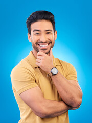 Canvas Print - Happy, man and smile portrait in studio with Asian model with confidence and headshot. Blue background, male person and casual fashion with handsome and friendly guy with modern style and outfit