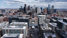 Aerial View Of Skyscrapers Of Denver, Colorado Under A Cloudy Sky