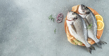 Wall Mural - Raw dorado fish on cutting board on a light background, Long banner format. top view