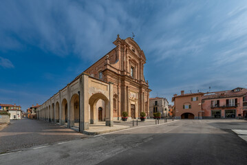 Wall Mural - Fossano, Cuneo, Italy: parish church of San Filippo (18th century) in piazza Aldo Nicolaj with the arcade and the buildings of the historic center