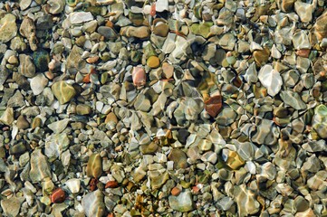 Wall Mural - Image featuring the texture of rocks and stones in a body of water