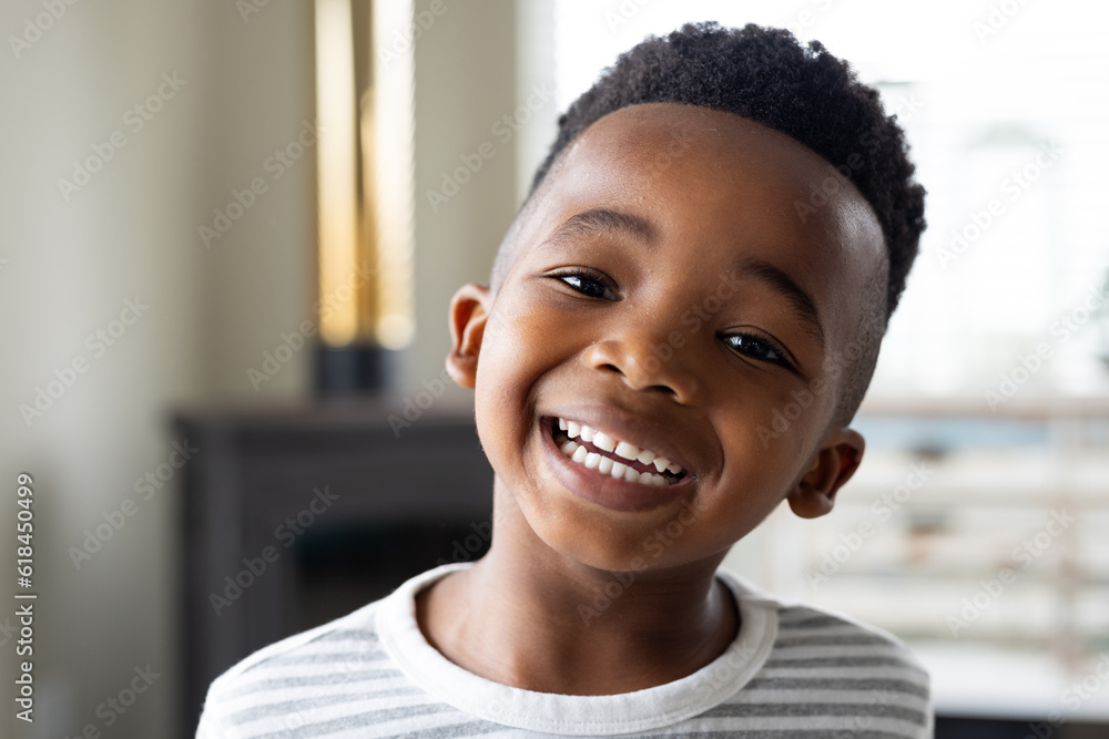 Portrait of happy african american boy looking at camera and smiling ...
