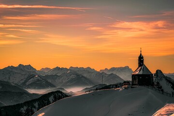 Canvas Print - Majestic scene of a traditional alpine church surrounded by snow-covered mountains in Austria