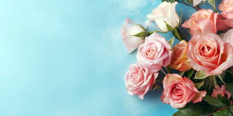 Wall Mural - Bouquet of pink and red roses on blue background with copy space