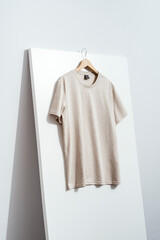 Wall Mural -  Beige t-shirt on wooden hanger, tshirt mockup