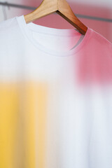 Wall Mural - White t-shirt on wooden hanger