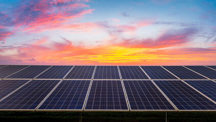 Wall Mural - Solar panels and colorful sunset clouds. green energy concept.